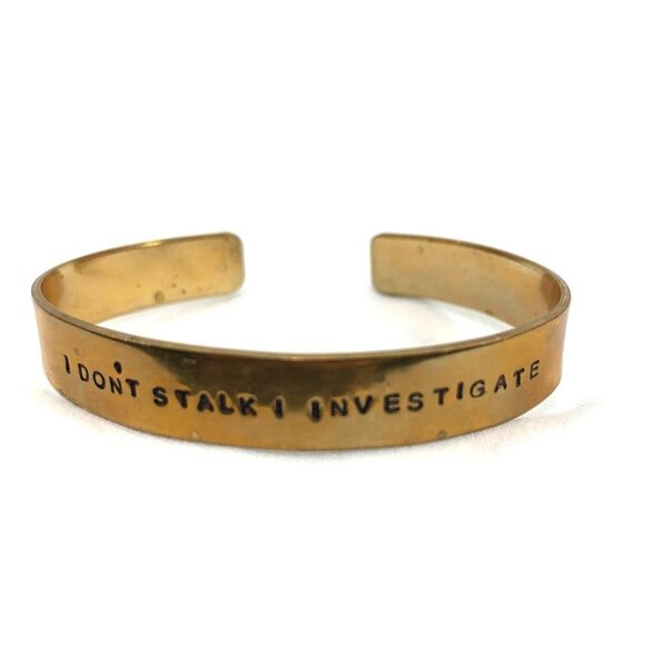 "I Don't Stalk I Investigate" Gold Tone Cuff Bangle 2.5" Diameter - Picture 1 of 4